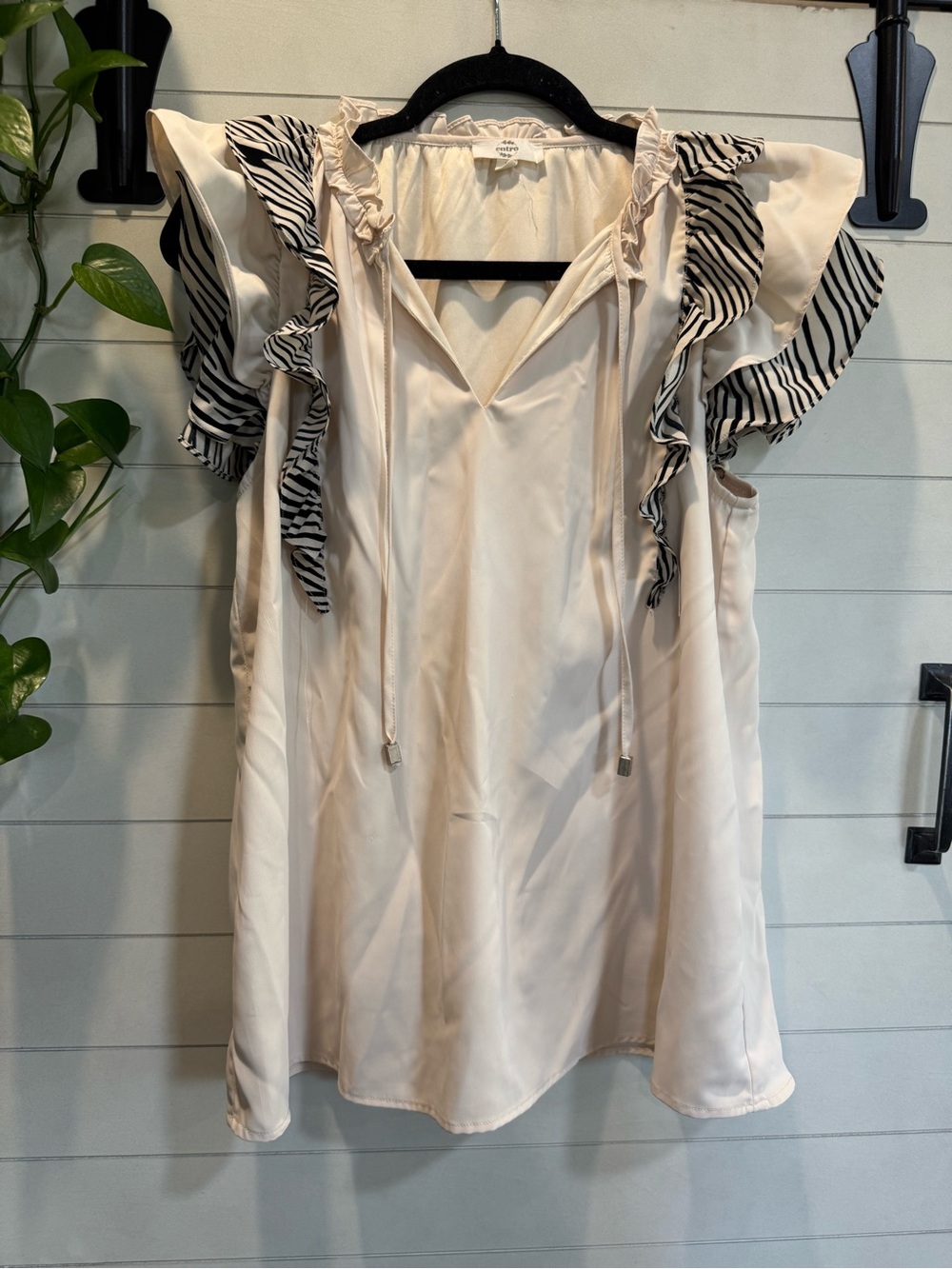 entro Cream Sleeveless Ruffle Blouse with Black-White Striped Trim